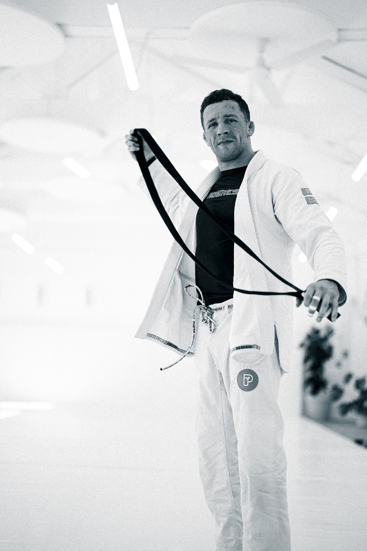 Sam holding his black belt